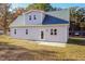 Gray house exterior with a back patio and landscaping at 0 Theresia Ln, Roxboro, NC 27574