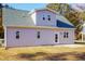 Gray house exterior with a back patio and landscaping at 0 Theresia Ln, Roxboro, NC 27574