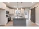 Modern kitchen with gray island, white cabinets, and barn door at 0 Theresia Ln, Roxboro, NC 27574