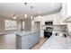 Modern kitchen with gray island and stainless steel appliances at 0 Theresia Ln, Roxboro, NC 27574