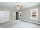 Main bedroom with carpet, barn door, and ceiling fan at 0 Theresia Ln, Roxboro, NC 27574