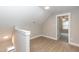 Upstairs hallway with hardwood floors and access to bedroom at 0 Theresia Ln, Roxboro, NC 27574