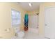 Bathroom with a toilet, window, and a shower/tub combo with a colorful shower curtain at 1000 W Landing Dr, Sanford, NC 27330