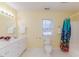 Well-lit bathroom featuring a toilet, vanity, and a shower with an eye-catching curtain at 1000 W Landing Dr, Sanford, NC 27330