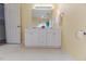 Bright bathroom with double sink vanity, white cabinets, and updated fixtures at 1000 W Landing Dr, Sanford, NC 27330