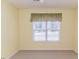Bedroom featuring a window with curtains and neutral carpet at 1000 W Landing Dr, Sanford, NC 27330