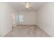 Bedroom featuring neutral carpet, ceiling fan and natural light at 1000 W Landing Dr, Sanford, NC 27330