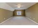 Spacious bedroom with neutral carpet, a ceiling fan, and a window with blinds at 1000 W Landing Dr, Sanford, NC 27330