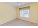 Bedroom with neutral carpet, ceiling fan, and a window with curtains at 1000 W Landing Dr, Sanford, NC 27330