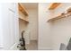 Walk-in closet featuring shelving and carpeted floor at 1000 W Landing Dr, Sanford, NC 27330