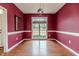 Bright dining room with hardwood floors, large window, and decorative light fixture at 1000 W Landing Dr, Sanford, NC 27330