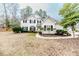 Charming two-story home with a well-maintained lawn and traditional architectural details at 1000 W Landing Dr, Sanford, NC 27330