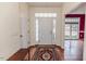 Bright foyer with decorative rug, and views of the living and dining rooms at 1000 W Landing Dr, Sanford, NC 27330