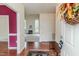Warm and inviting foyer with hardwood floors and a glimpse of the living room fireplace at 1000 W Landing Dr, Sanford, NC 27330