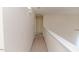 Hallway with neutral carpet and a white railing at 1000 W Landing Dr, Sanford, NC 27330