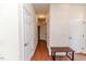 Hallway with hardwood floors and multiple doors at 1000 W Landing Dr, Sanford, NC 27330