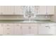 The kitchen offers white cabinets, a window above the sink, and an efficient layout for meal preparation at 1000 W Landing Dr, Sanford, NC 27330