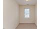 Small room with neutral carpet and a window overlooking the outdoors at 1000 W Landing Dr, Sanford, NC 27330