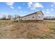 Spacious backyard featuring an outdoor seating area, offering ample room for relaxation and entertainment at 117 Hinshaw Shop Rd, Liberty, NC 27298