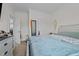 Main bedroom with a large bed and ensuite bathroom at 117 Hinshaw Shop Rd, Liberty, NC 27298