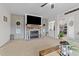 Cozy living room with stone fireplace and large TV at 117 Hinshaw Shop Rd, Liberty, NC 27298