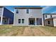 Exterior of home featuring backyard with a covered porch, showing vinyl siding at 120 Anise Tree Way, Clayton, NC 27527