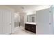 Bathroom featuring a glass-enclosed shower, vanity with dark wood cabinets, and modern fixtures at 120 Anise Tree Way, Clayton, NC 27527