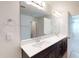 Bright bathroom with double sinks, dark wood cabinets, and a large mirror for a modern touch at 120 Anise Tree Way, Clayton, NC 27527