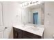 Well-lit bathroom featuring double sinks, a large mirror, and stylish fixtures at 120 Anise Tree Way, Clayton, NC 27527