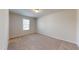 Well-lit bedroom with plush carpet and a window offering a bright and inviting atmosphere at 120 Anise Tree Way, Clayton, NC 27527