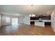 Spacious living room featuring an open floor plan, recessed lighting, and a seamless flow into the modern kitchen at 120 Anise Tree Way, Clayton, NC 27527