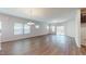 Spacious living room with hardwood floors, offering an open and inviting atmosphere with sliding glass doors at 120 Anise Tree Way, Clayton, NC 27527