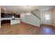 Spacious living room featuring an open floor plan, recessed lighting, and a seamless flow into the modern kitchen at 120 Anise Tree Way, Clayton, NC 27527