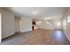 Open-concept living room showcasing hardwood floors, connecting seamlessly to the kitchen and dining area at 120 Anise Tree Way, Clayton, NC 27527