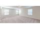 Upstairs loft with three windows, neutral carpeting and recessed lighting at 120 Anise Tree Way, Clayton, NC 27527