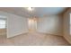 Open loft area with carpeting, multiple windows, and access to hallway at 120 Anise Tree Way, Clayton, NC 27527