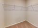 View of spacious closet with neutral colored walls and carpets, plus practical wire shelving for organization at 120 Anise Tree Way, Clayton, NC 27527