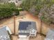Aerial view of a home with solar panels and a playground in the back yard at 12420 Tetons Ct, Durham, NC 27703