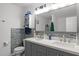 Bathroom boasts double sinks, modern tile backsplash, and decorative mirror at 12420 Tetons Ct, Durham, NC 27703