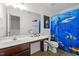 Bathroom featuring a single sink, a toilet, and a shower with a playful shark-themed curtain at 12420 Tetons Ct, Durham, NC 27703