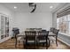 Elegant dining room with modern furniture and a ceiling fan, perfect for gatherings at 12420 Tetons Ct, Durham, NC 27703