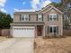 Charming two-story home with a two-car garage and solar panels on the roof at 12420 Tetons Ct, Durham, NC 27703