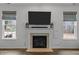 Cozy living room featuring a fireplace and natural light at 12420 Tetons Ct, Durham, NC 27703