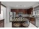 Bright kitchen features stainless steel appliances, a center island, and tile backsplash at 12420 Tetons Ct, Durham, NC 27703