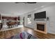 Open-concept living area with a fireplace and kitchen, ideal for entertaining at 12420 Tetons Ct, Durham, NC 27703