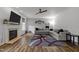 Inviting living room with a cozy fireplace and large sectional sofa, great for relaxing at 12420 Tetons Ct, Durham, NC 27703