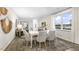 Spacious dining area with large windows and seating for six at 1316 White Verona Way, Knightdale, NC 27545