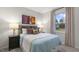 Well-lit bedroom featuring a light blue comforter and tasteful artwork at 1320 White Verona Way, Knightdale, NC 27545
