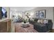 Spacious living area showcasing a comfortable sectional and large TV at 1320 White Verona Way, Knightdale, NC 27545
