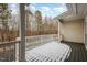 Back deck with white railings and winter scene at 203 Anniston Ct, Cary, NC 27519